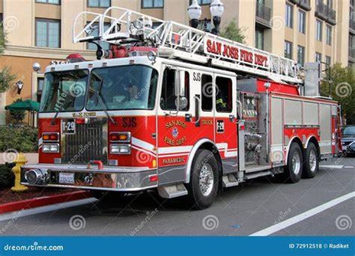 a fire truck parked in front of a building