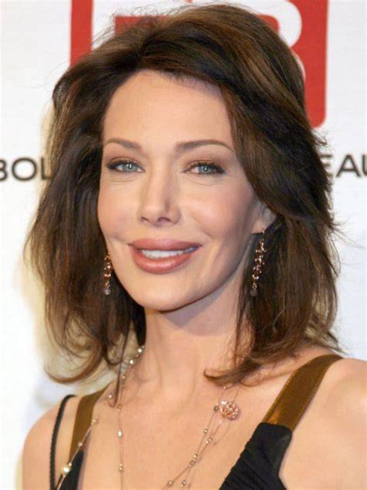 Actress Hunter Tylo and husband Gersson Archila pose for a portrait